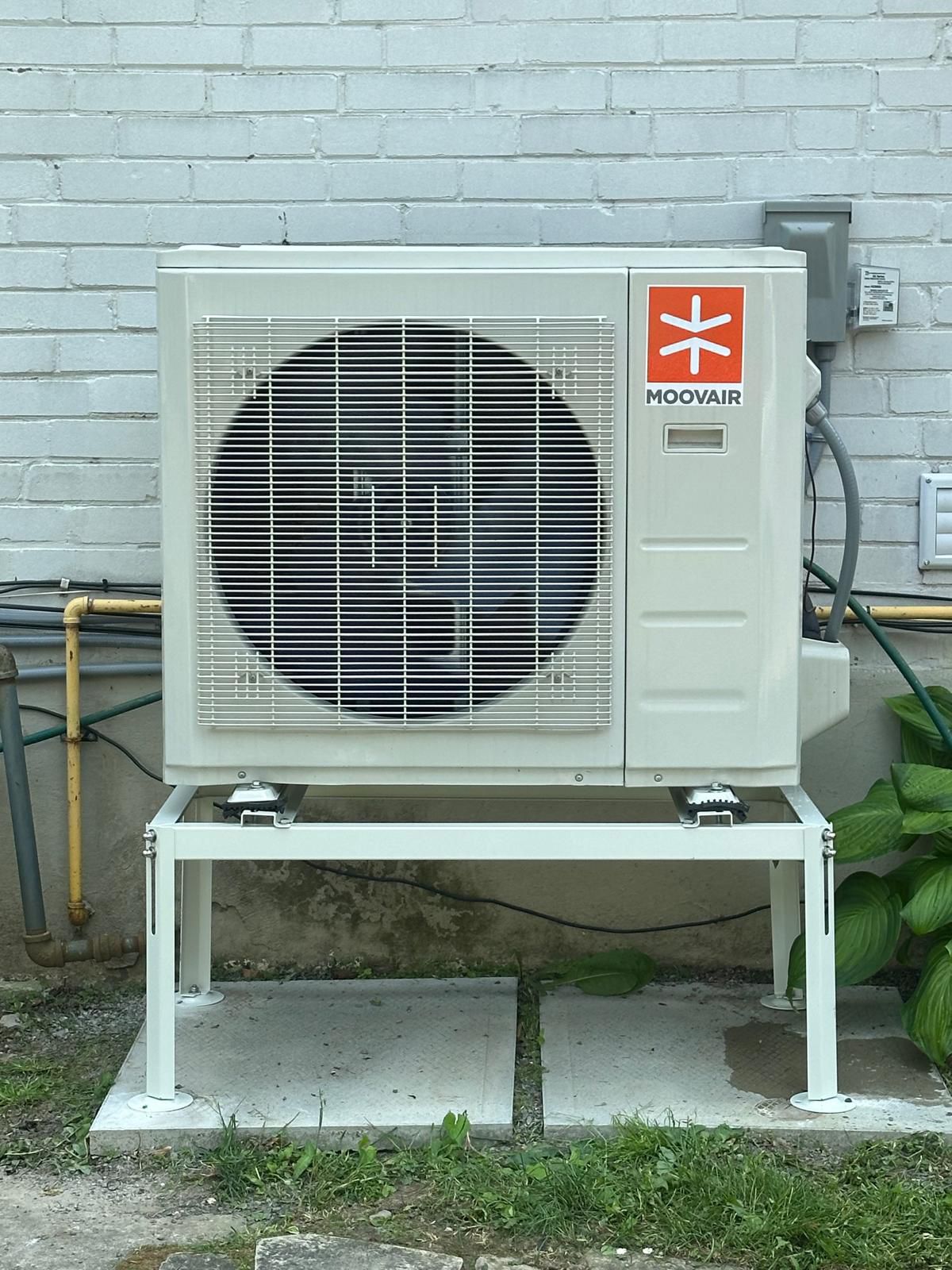 Modern ductless air conditioning unit installed on interior wall
